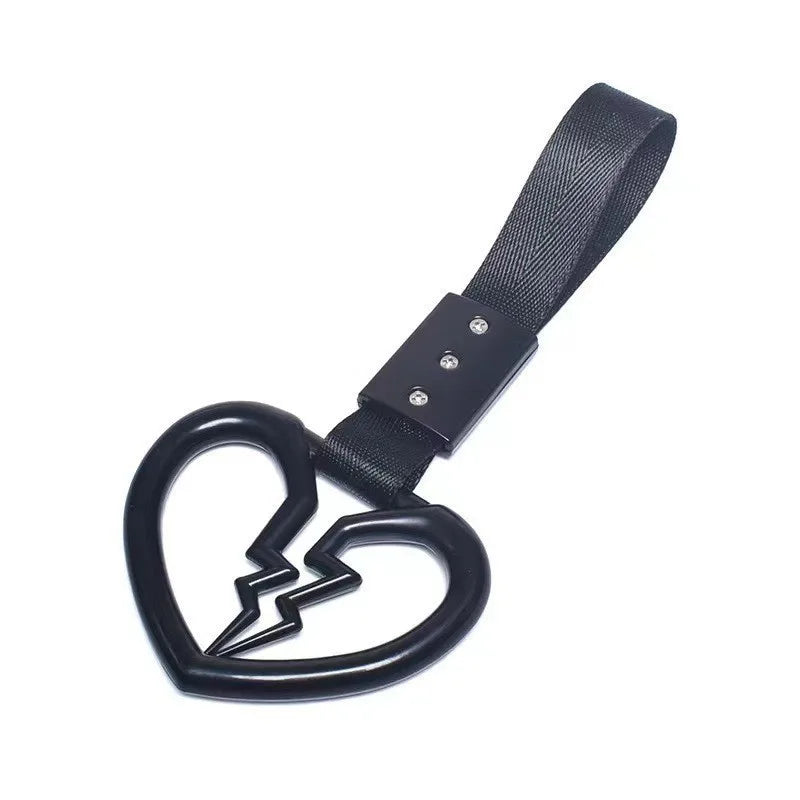 Black strap with a heart charm and a lightning bolt design.