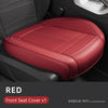 A red front seat cover for a car seat, showing the texture and fit inside a vehicle interior.
