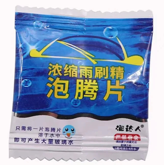A package of effervescent tablet for windshield cleaning, featuring blue and yellow graphics.