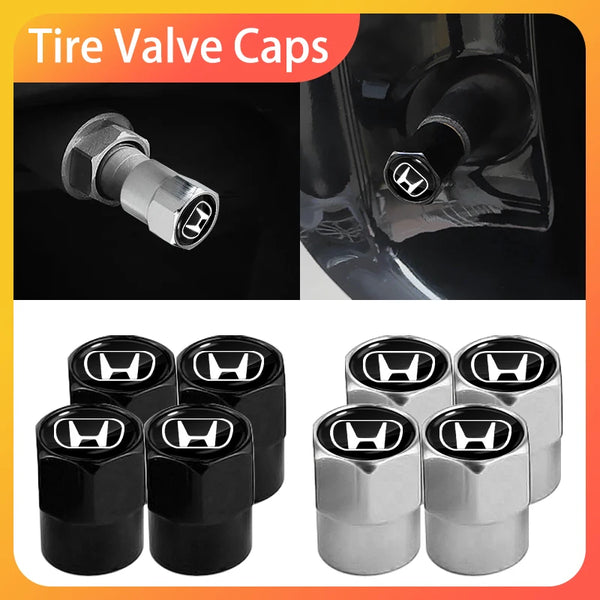 A set of four durable anodized tire valve caps in black and silver finishes.