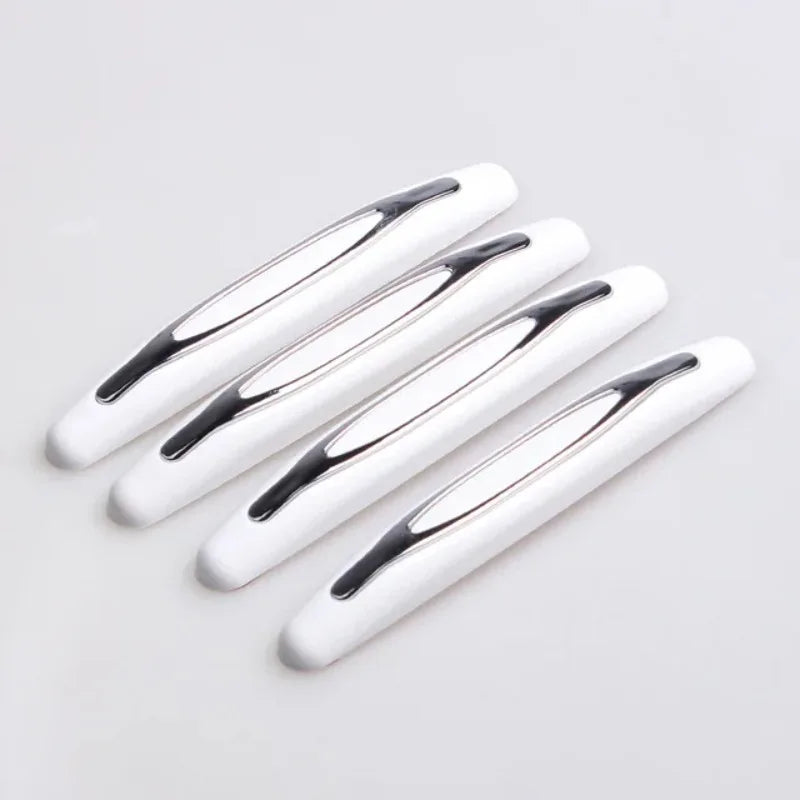 A set of white car door edge protection strips arranged diagonally on a light gray background.