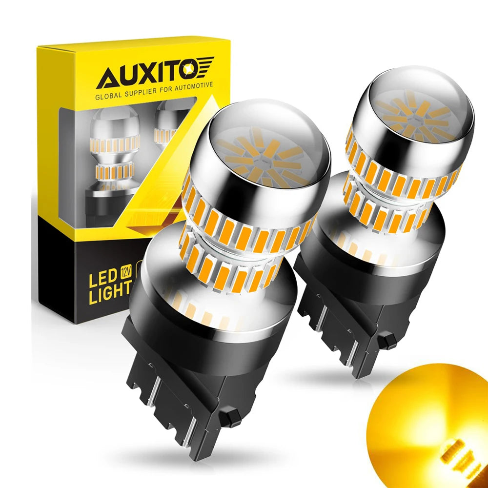 A box and several black LED light bulbs with orange accents are shown for automotive use.