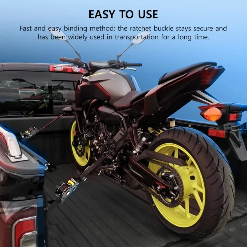 A black motorcycle is shown with a yellow tire and a heavy duty automatic retractable ratchet strap used for transportation.