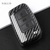 Black carbon fiber button cover for a car key, featuring three distinct buttons.