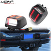 LED license plate lights installed on a black vehicle bumper.