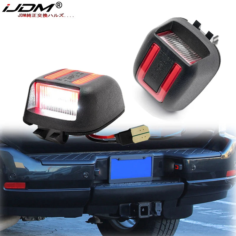 LED license plate lights installed on a black vehicle bumper.