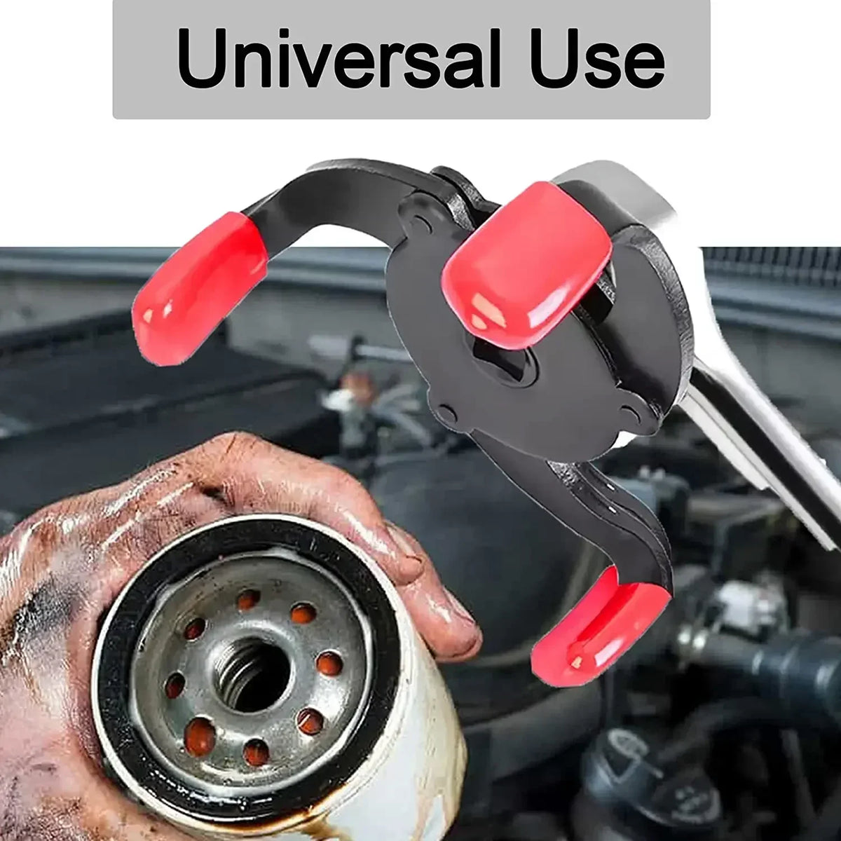 A hand is using a black and red oil filter removal tool to access an oil filter on a vehicle engine.