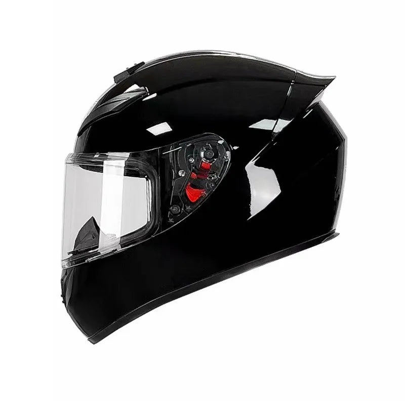 A glossy black universal motorcycle helmet with a clear visor and red accents.