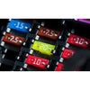 A close-up view of an assortment kit of blade fuses for automotive, showing various colored fuses.