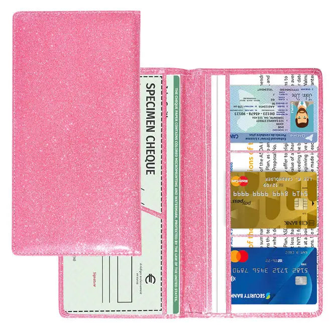 A pink leather document holder with a clear plastic sleeve and a green spine for car registration and insurance documents