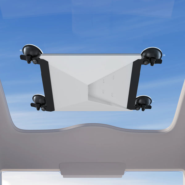 A white car suction mount designed to hold a Starlink Mini device, shown against a blue sky background.