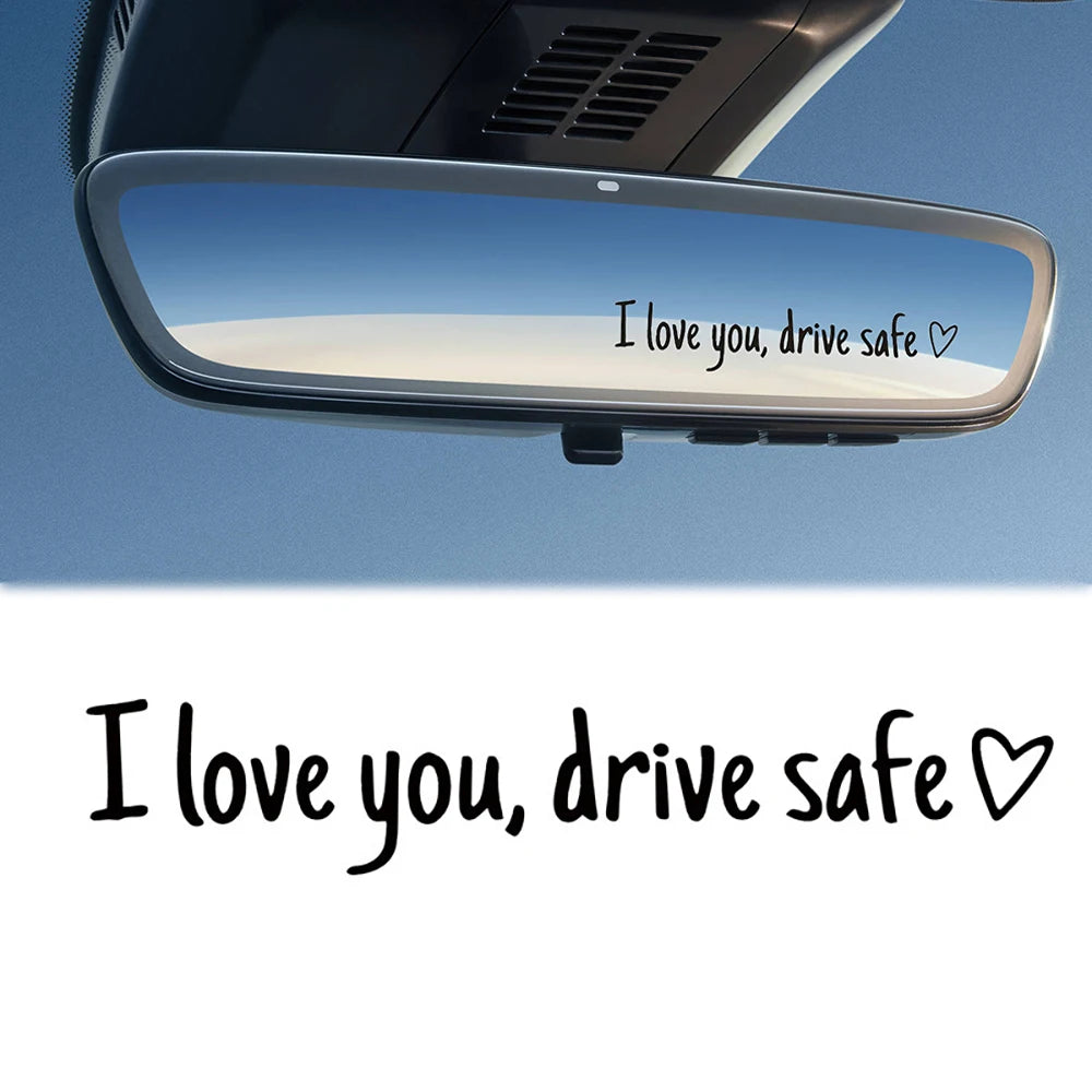 A car mirror with a message that reads I love you drive safe