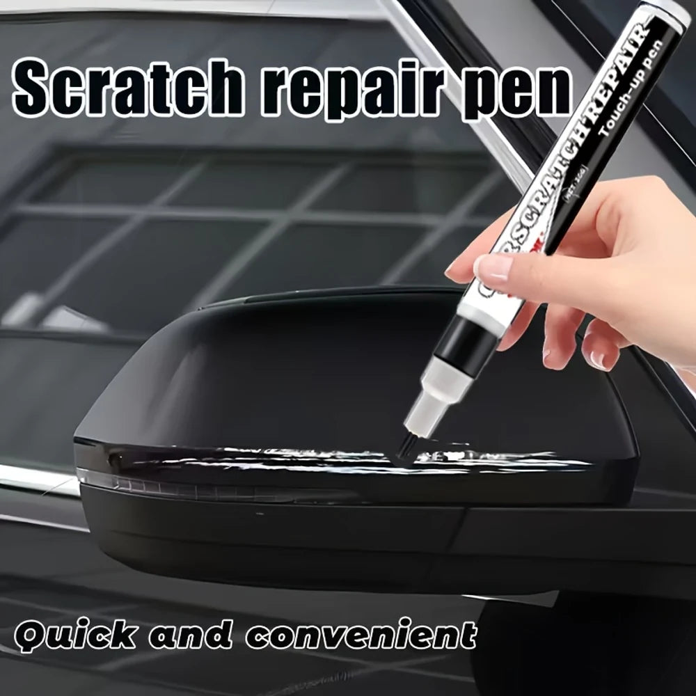 A hand uses a scratch repair pen to touch up scratches on a black car surface.