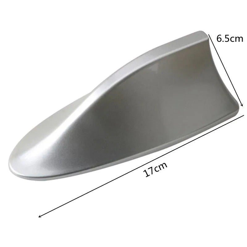 A silver carbon fiber look roof mount antenna with dimensions 17cm long and 6.5cm high.