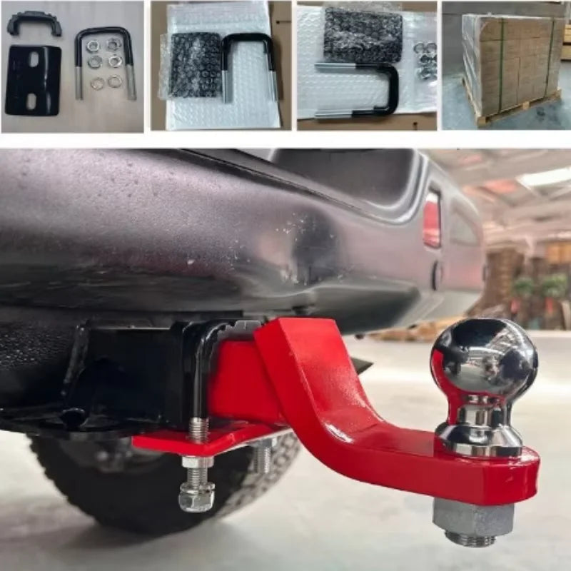 A close-up view of a red heavy duty trailer hitch clamp and isolator mounted on a vehicle's bumper.