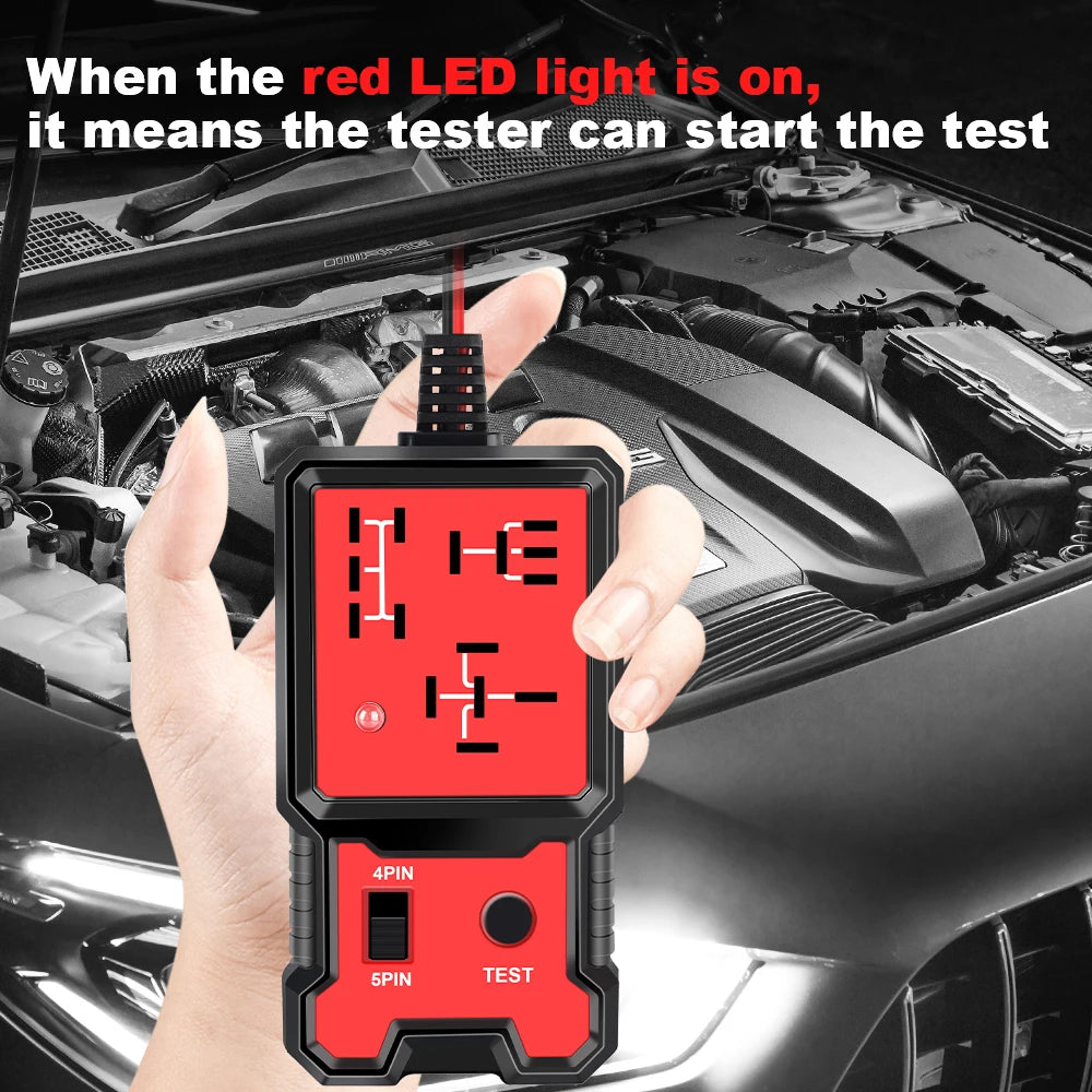 A hand holds a red LED light automotive relay tester device with test buttons in a car engine bay context.