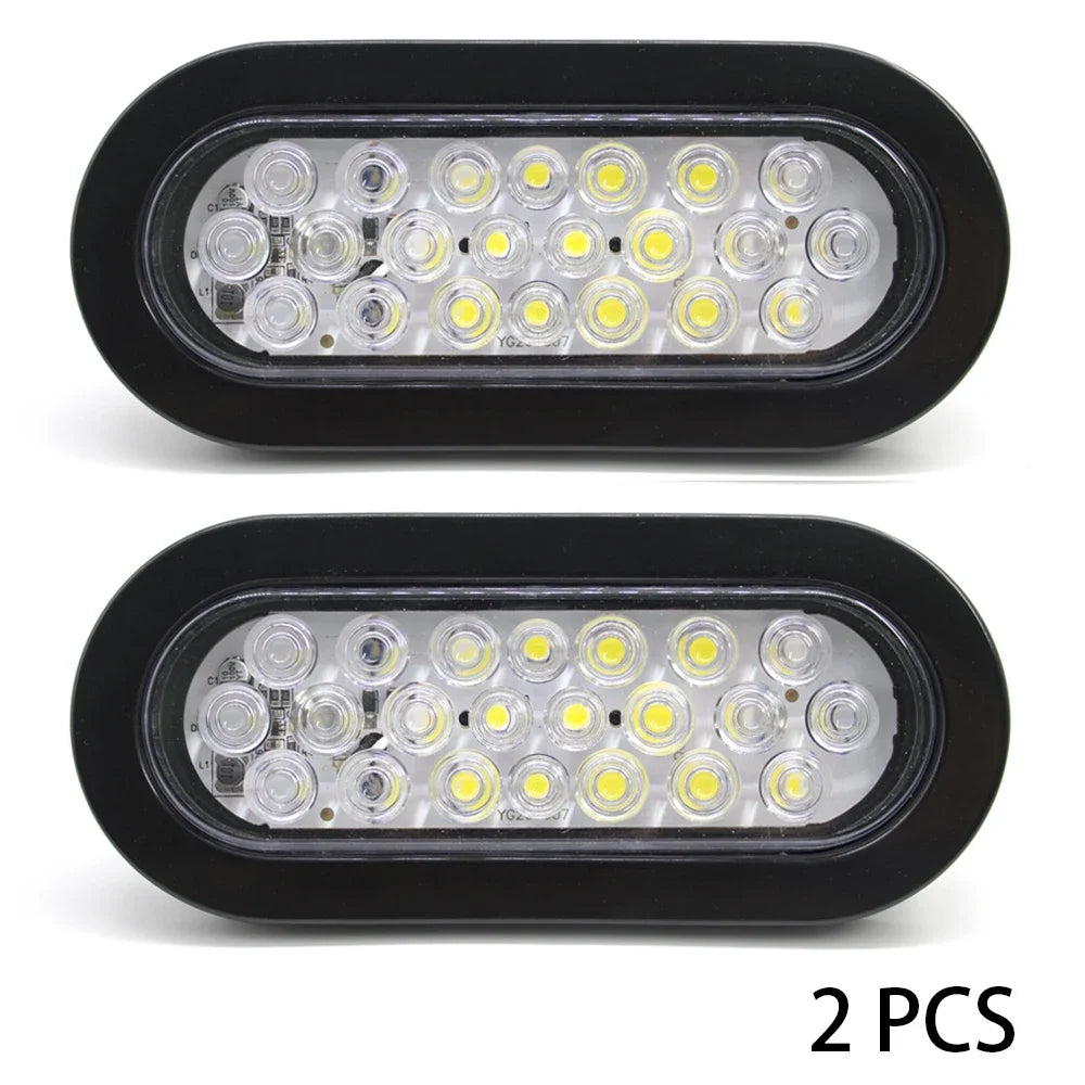Two black rectangular LED brake and marker lights with multiple clear bulbs each