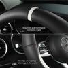 Close-up of a black steering wheel showing an exquisite centering mark and durable stitching at the seam.