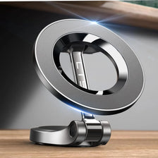 Support de téléphone MagSafe pour voiture argenté à rotation 360° sur une surface en bois.