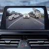 A view from a car's interior showing the field of vision of a 170° HD backup camera.