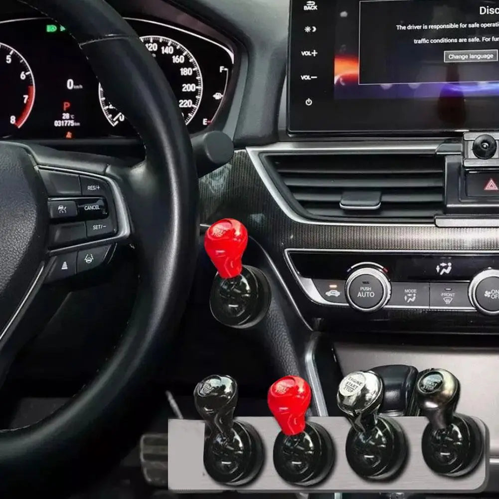 Close-up view of an all-metal cylindrical car start button accessory with various colored and metallic finishes.