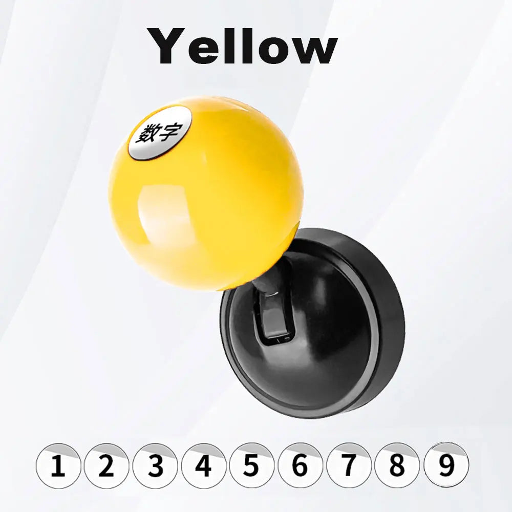 A yellow car start button cover with Chinese characters on top and a black base, numbered 1 through 9 below.