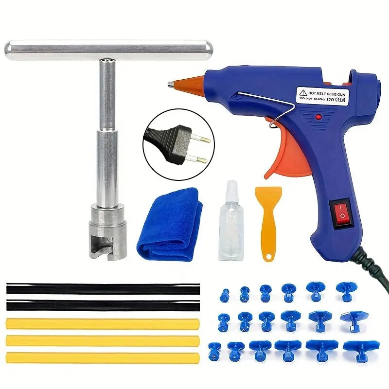 A professional auto dent repair kit showing a heat gun, various tools, and metal rods.