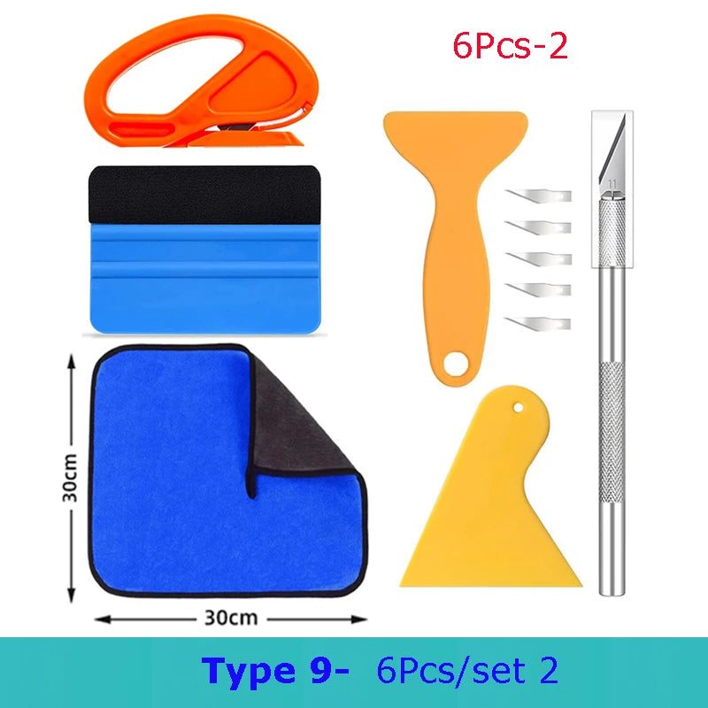 A set of nine professional car vinyl wrapping tools including a heat gun, cutting tools, and applicator kit.