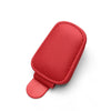 A red magnetic leather holder designed to secure sunglasses in a car sun visor.