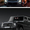 Primer plano de un SUV Mercedes negro con luces LED aftermarket instaladas en la parrilla y los faros.