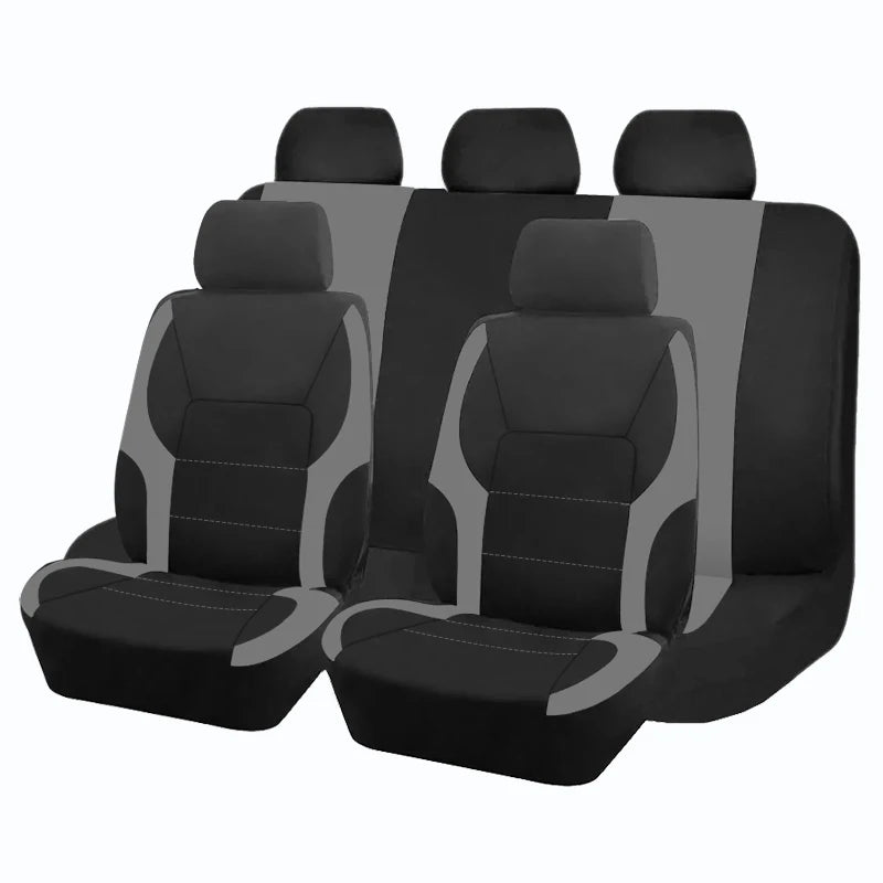 Ein Set schwarzer und grauer universeller Auto-Sitzbezüge für mehrere Sitze.