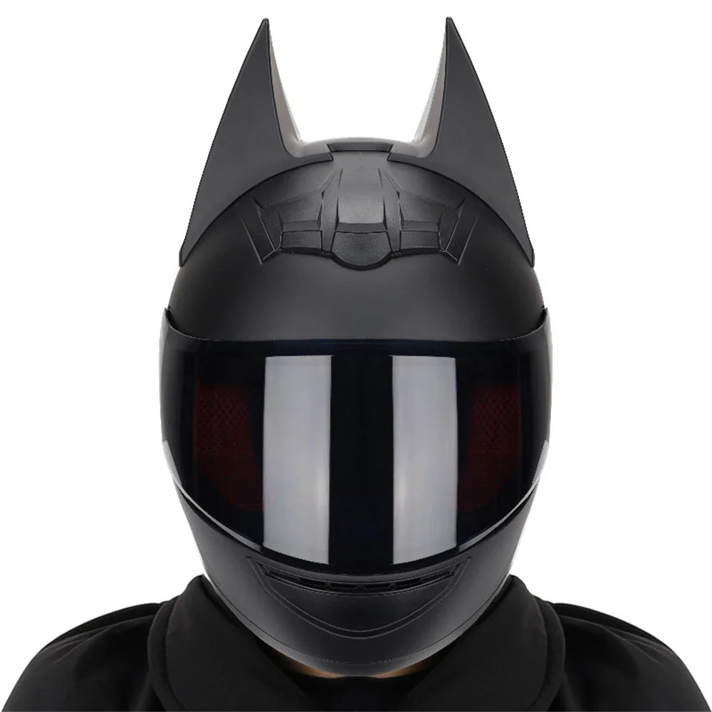 A black full face motorcycle helmet with detachable horns shown from the front.