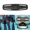 A black car seat belt clip is shown with a gray harness strap and a light blue car seat in the background.