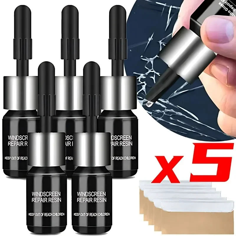 Five black plastic bottles of windshield and window repair resin with a silver applicator shown next to a dark surface