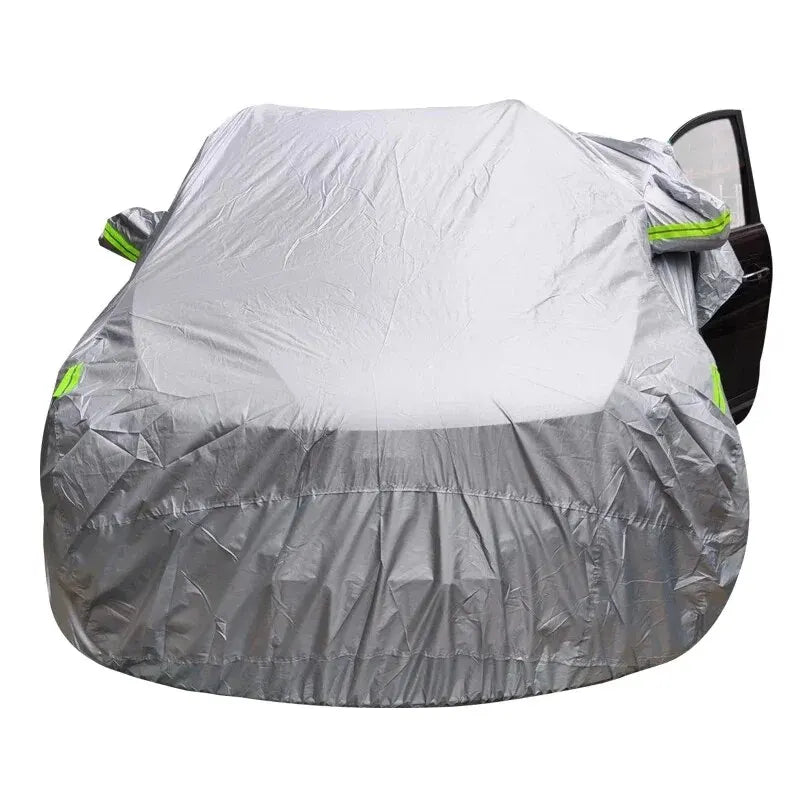 Gray universal all-weather car cover for an SUV or sedan, shown folded.