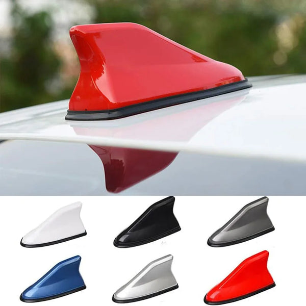 A collection of various colored shark fin universal car antenna amplifiers shown in different angles.