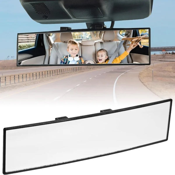 A clip-on wide angle rear view mirror mounted on a vehicle, showing the interior and exterior view.