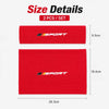 A set of two red sports shoulder pads for car seat belts, showing their size and dimensions.