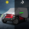 A heavy-duty waterproof car cover is shown over a Jeep Wrangler, with a green indicator light visible on the side.