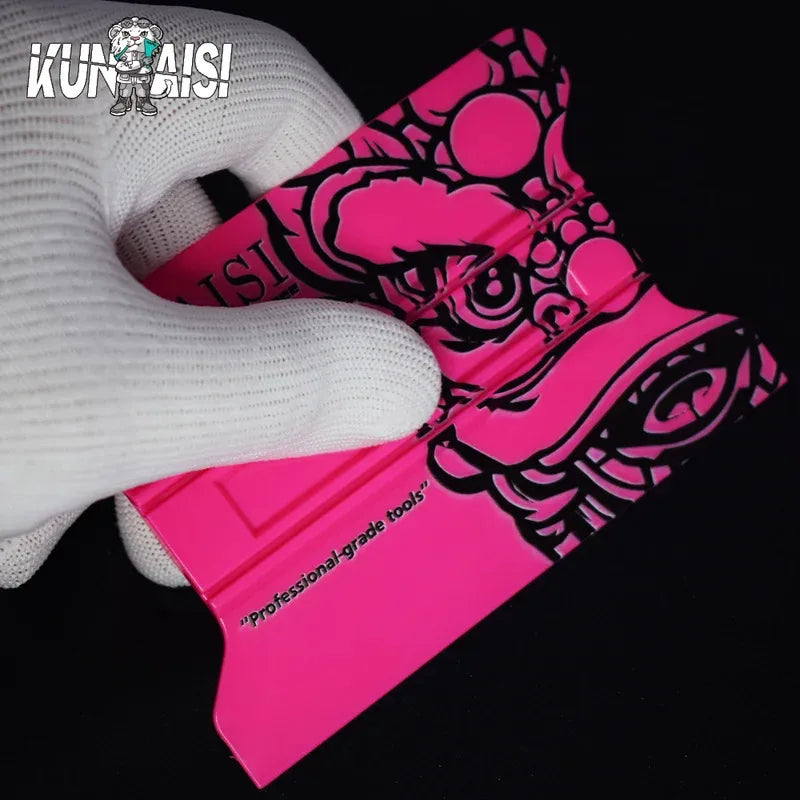 A pink magnetic suction car vinyl wrap film scraper kit is shown next to a white glove.