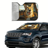 A foldable car windshield sun shade is shown installed in a dark blue SUV.