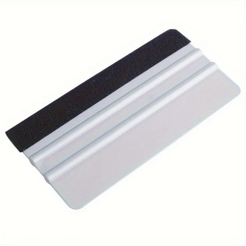 A precision scratch-free decal applicator tool with a black and white layered design.