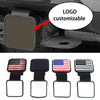 A set of customizable black and red American flag logo covers for a universal trailer hitch.