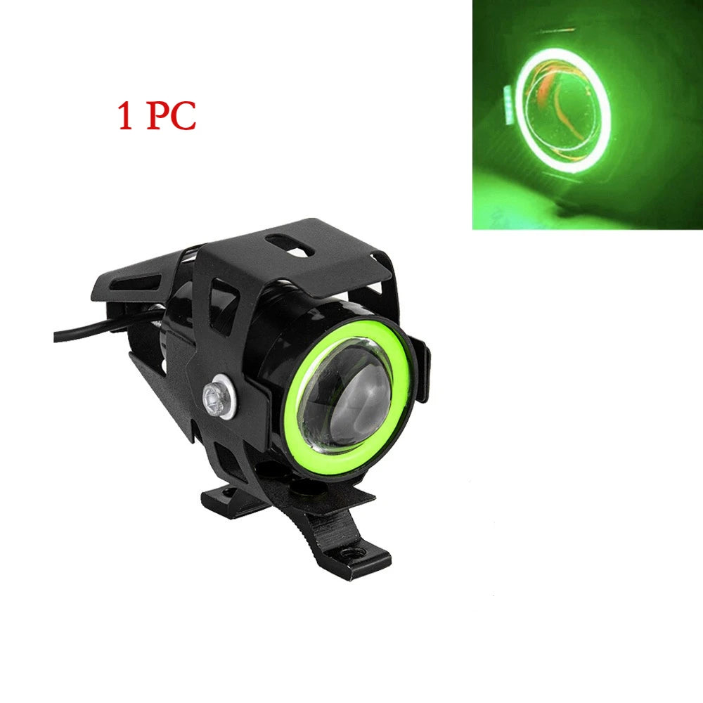 One piece universal LED motorcycle headlight spotlight with a black housing and bright green light.