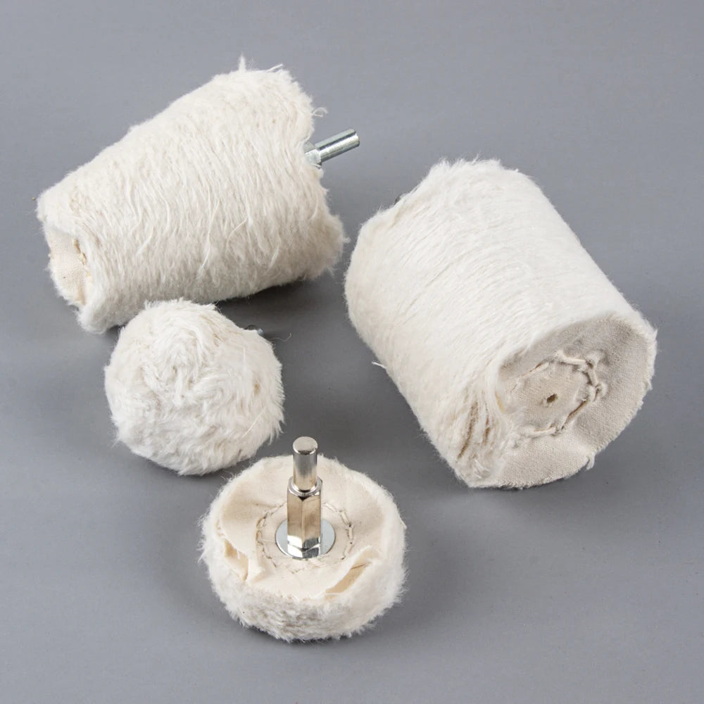 A spool of white natural fiber used as a 1/4 shank polishing wheel for jewelry and metalwork.