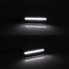 Close-up of an LED side marker turn signal light illuminating a surface.