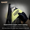 A hand wearing a black glove is using a trapezoidal scraper tool for seam sealing on car film.