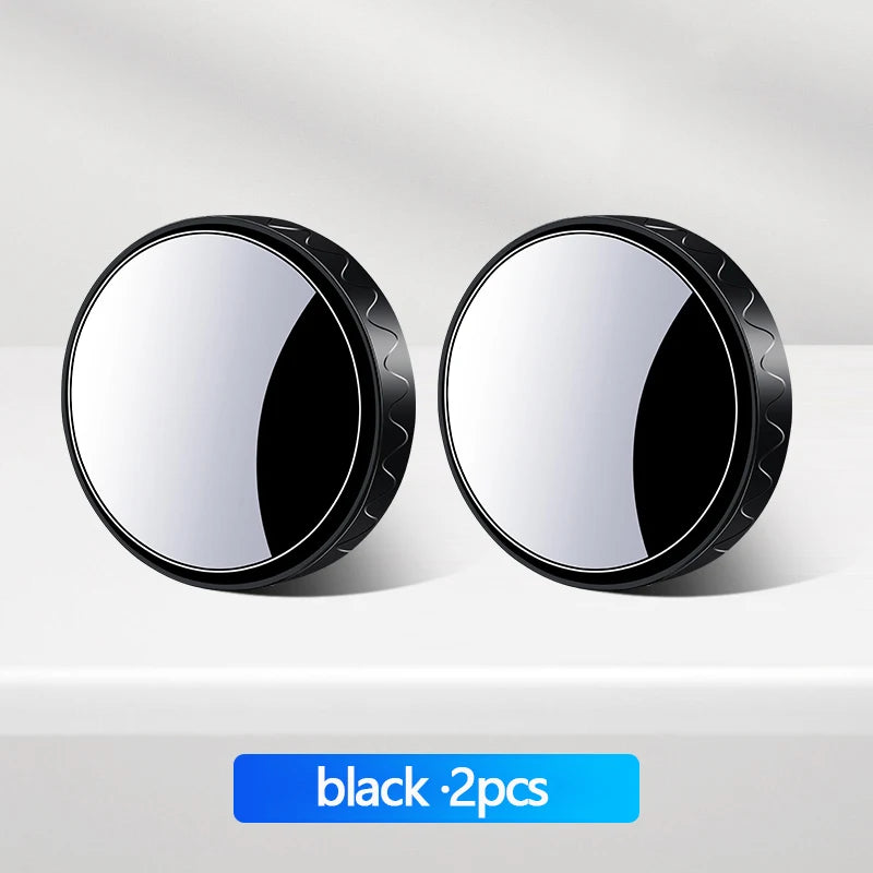 Two round black car blind spot mirrors shown on a white surface.