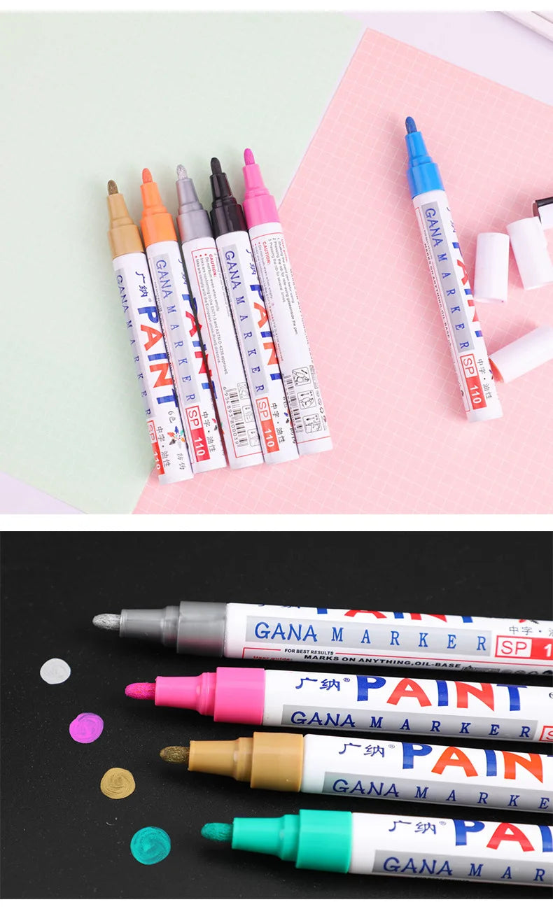 Collection de 12 marqueurs à peinture permanente à base d'huile colorés pour la création, présentés sur fond rose.
