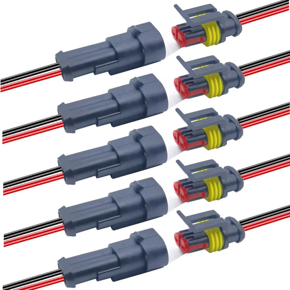 A set of waterproof electrical connectors with pre-wired leads in gray and red color.